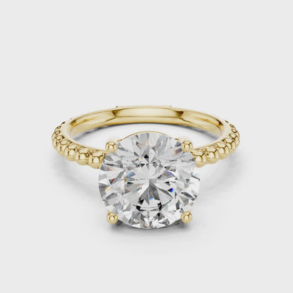 Elegant Gold Solitaire Ring with Brilliant Diamond | Beaded Band Design